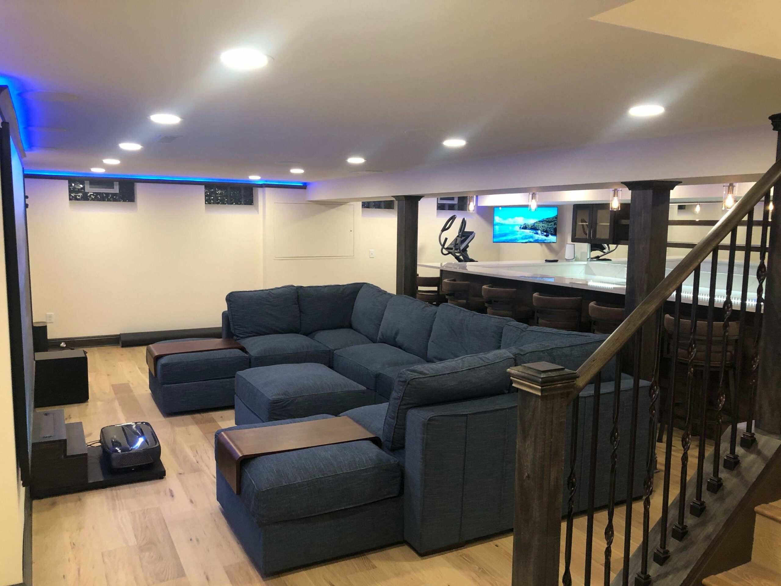 Keselman Construction Group Inc Basement Remodel Couches Surrounding TV with Bar