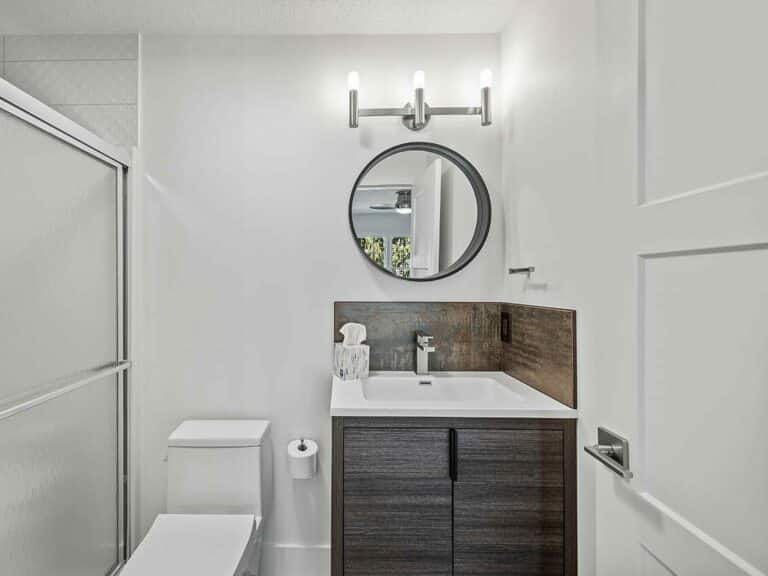A small but bright and modern bathroom after being remodeled by Keselman Construction Group