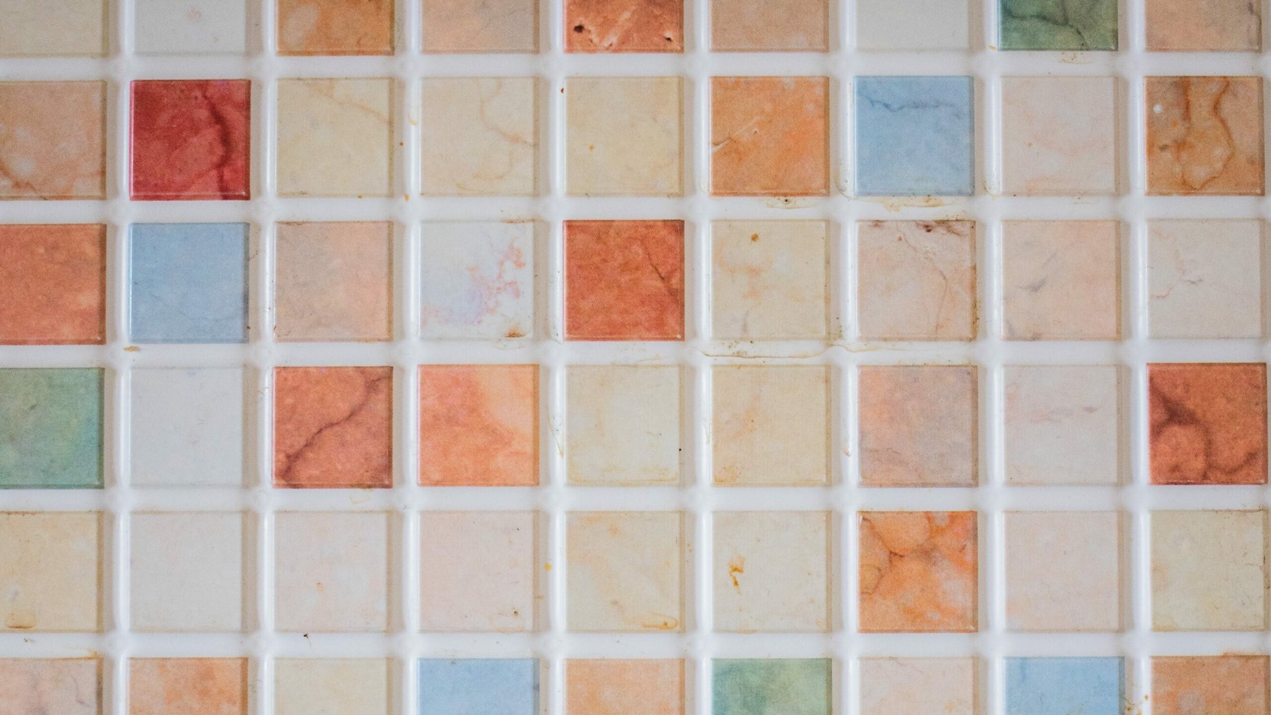Reclaimed and recycled glass and other materials make for a captivating and colorful tile design.